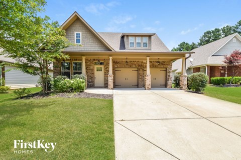 a house with a driveway and a garage door