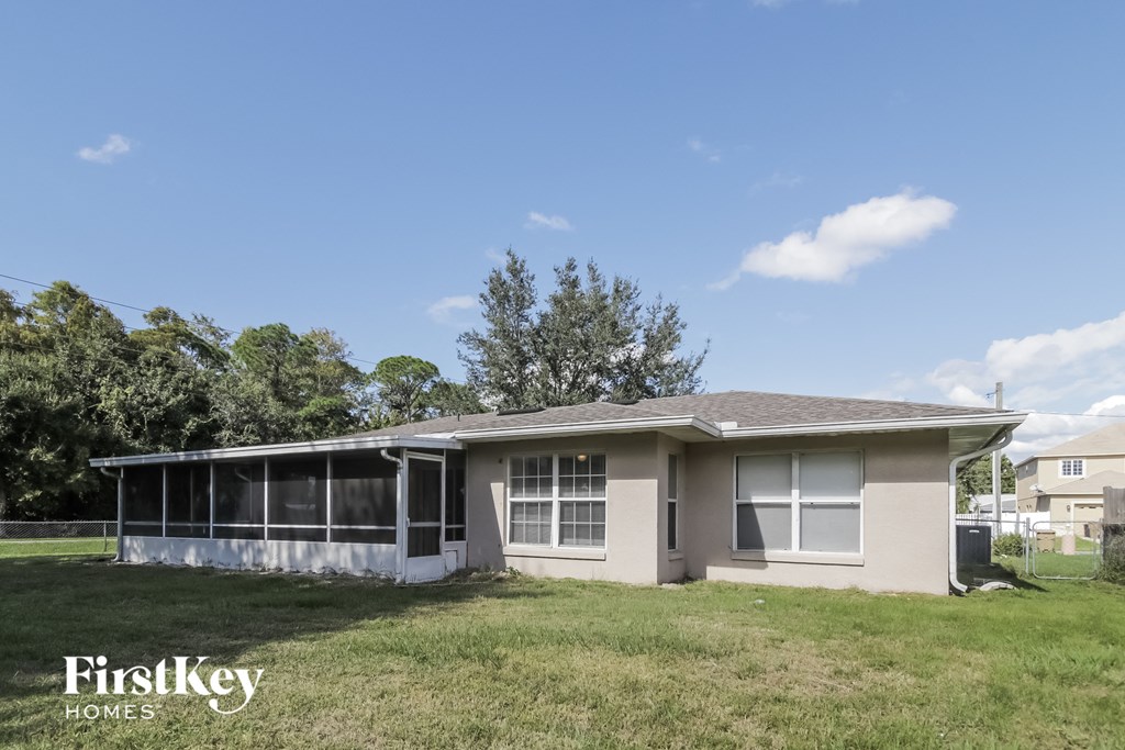 A house with a lawn in front of it.