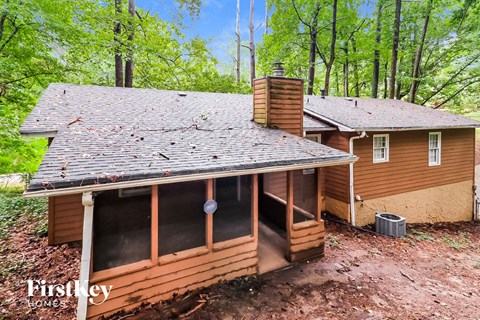 a view of the roof on a cabin in the woods