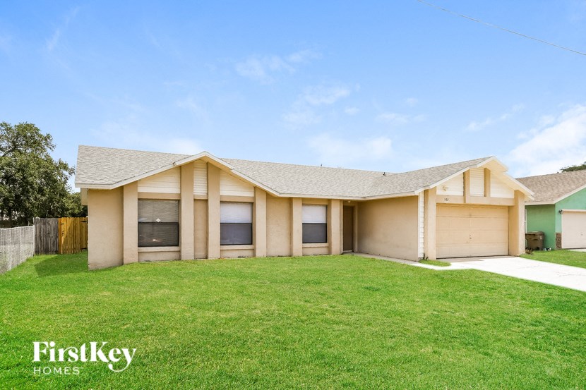 a home with a lawn in front of it