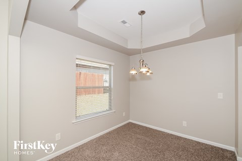 a bedroom with a ceiling fan and a window