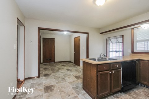 A kitchen with a sink and cabinets.