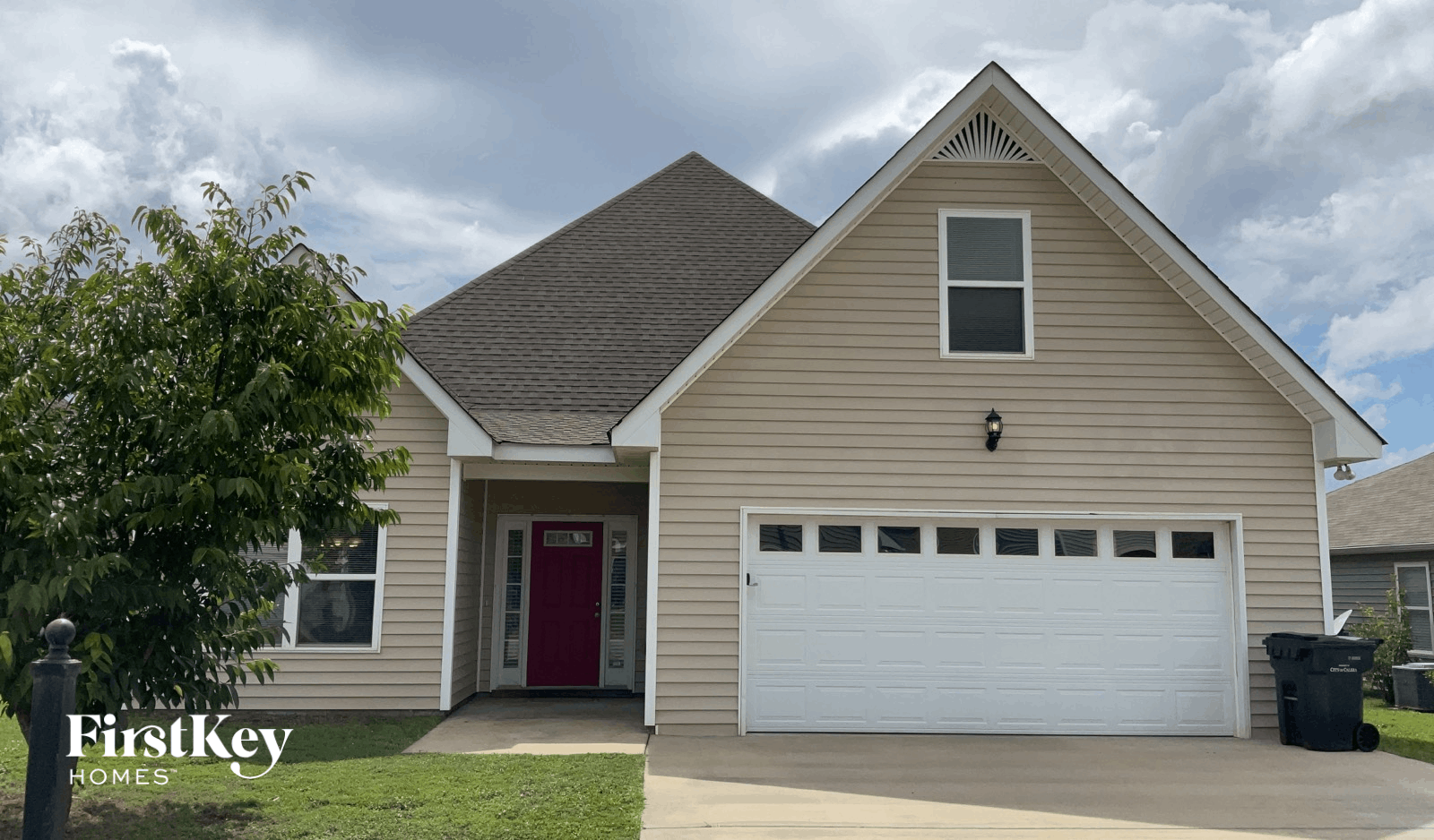 a house with a white garage door in front of it