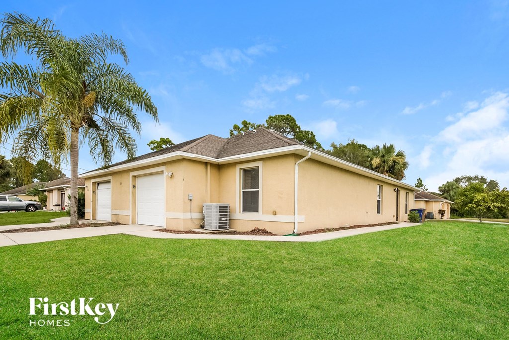 A house with a lawn in front of it.
