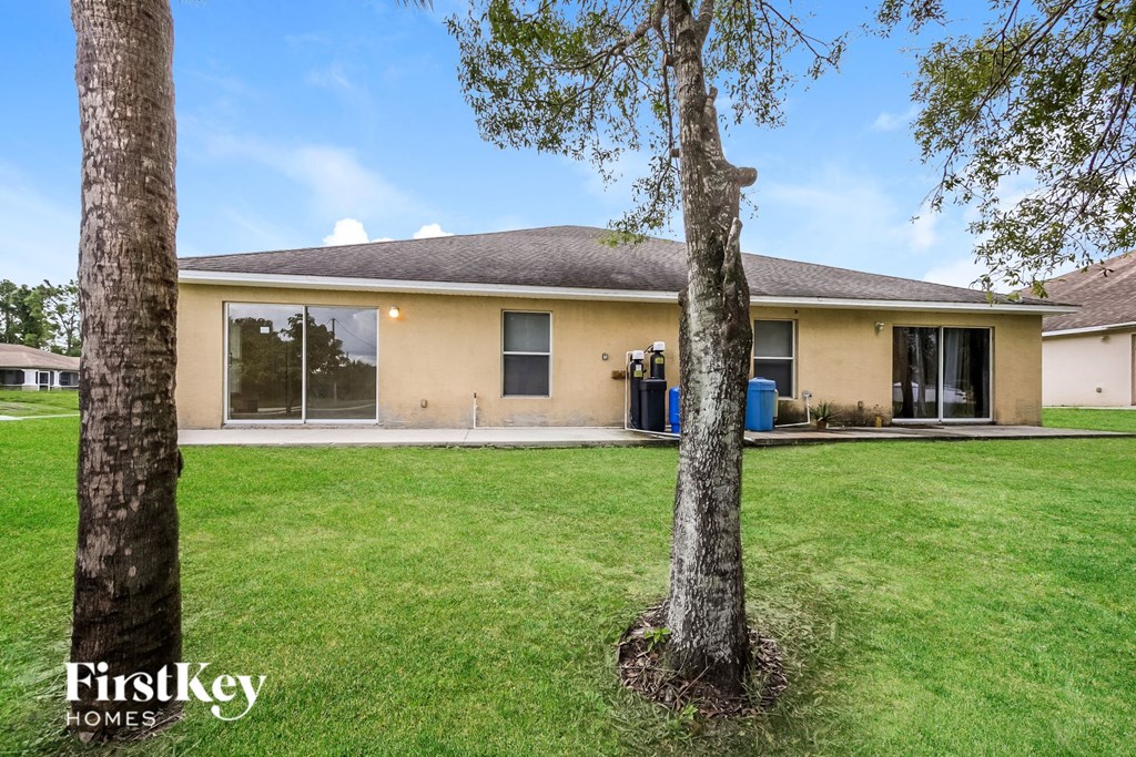 A house with a tree in front of it.