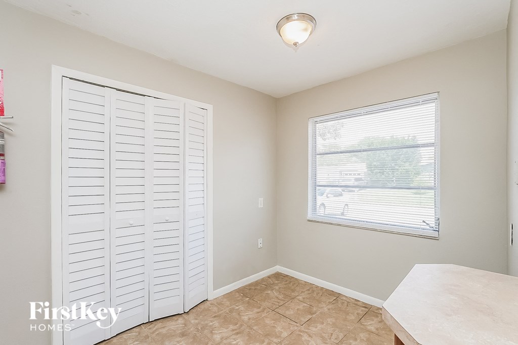 A room with a sliding door and a window.
