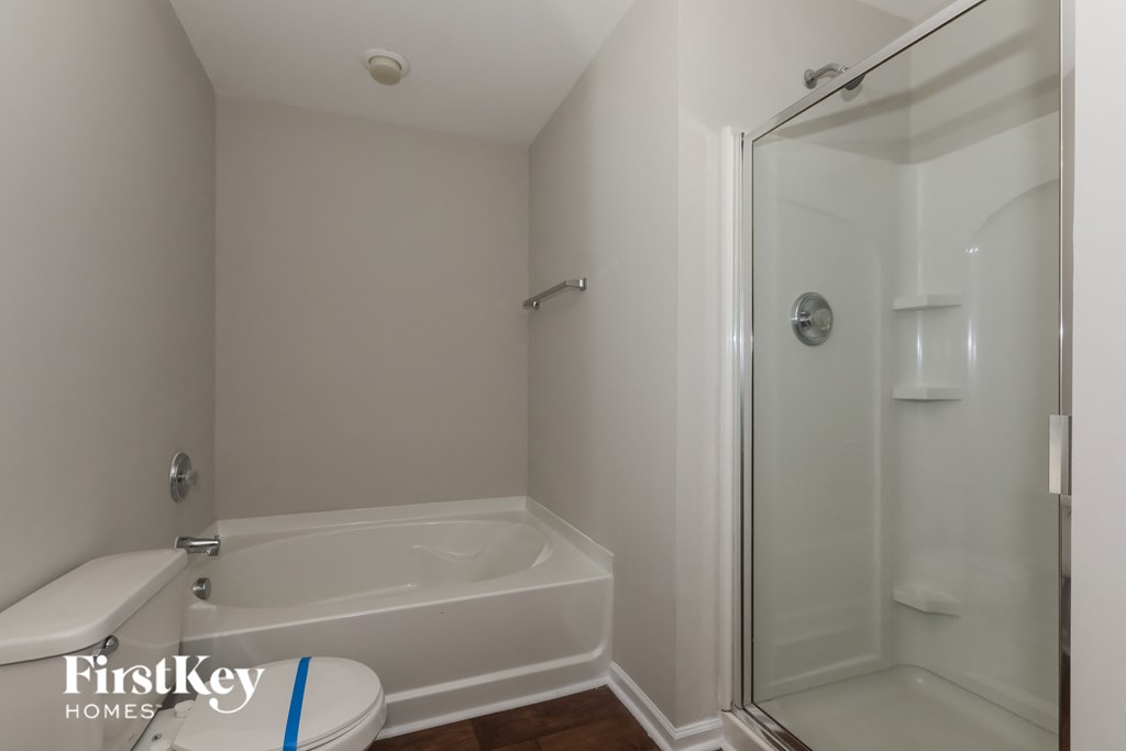 a small bathroom with a shower and a toilet