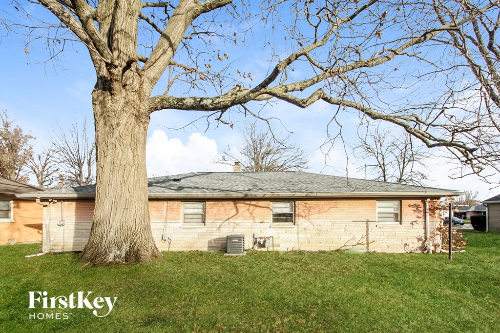a house with a tree in front of it
