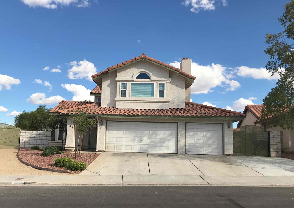 a house with a driveway and a garage door
