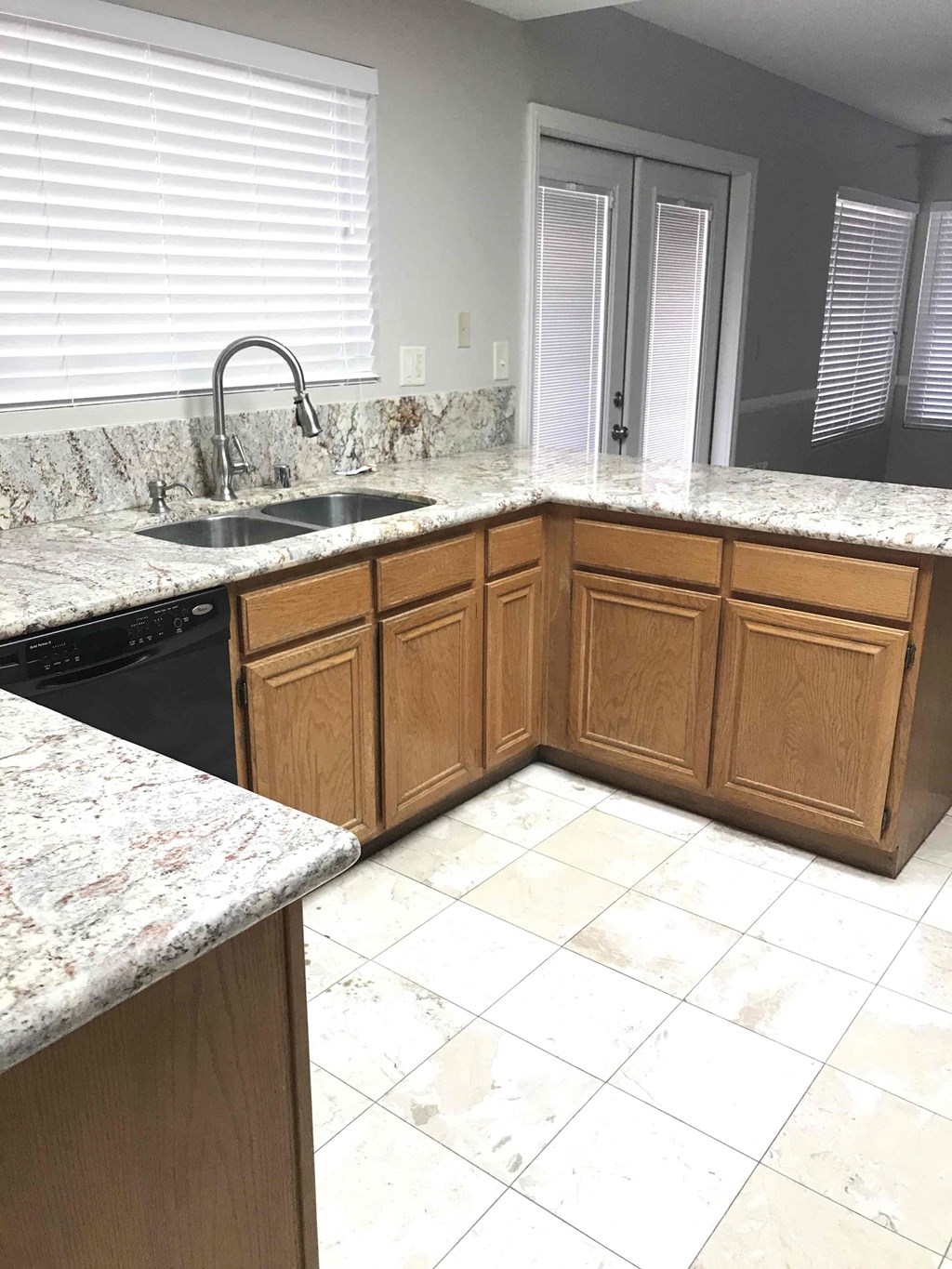 a kitchen with granite counter tops and a sink