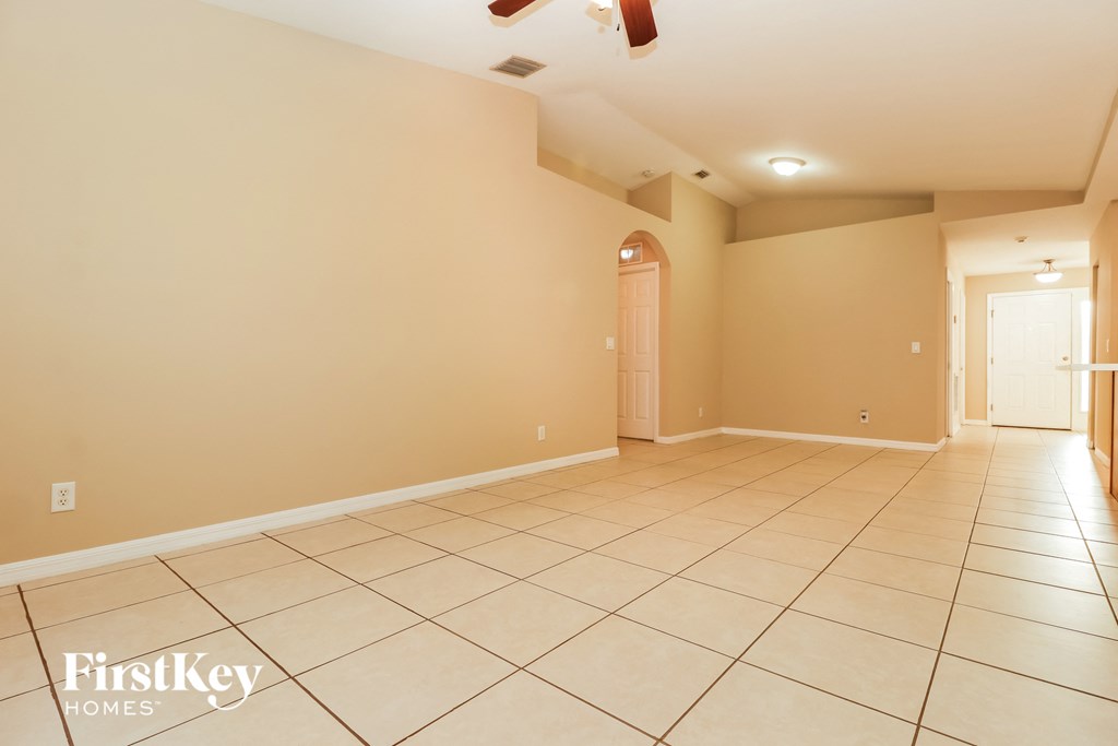 the living room and dining room are spacious and empty