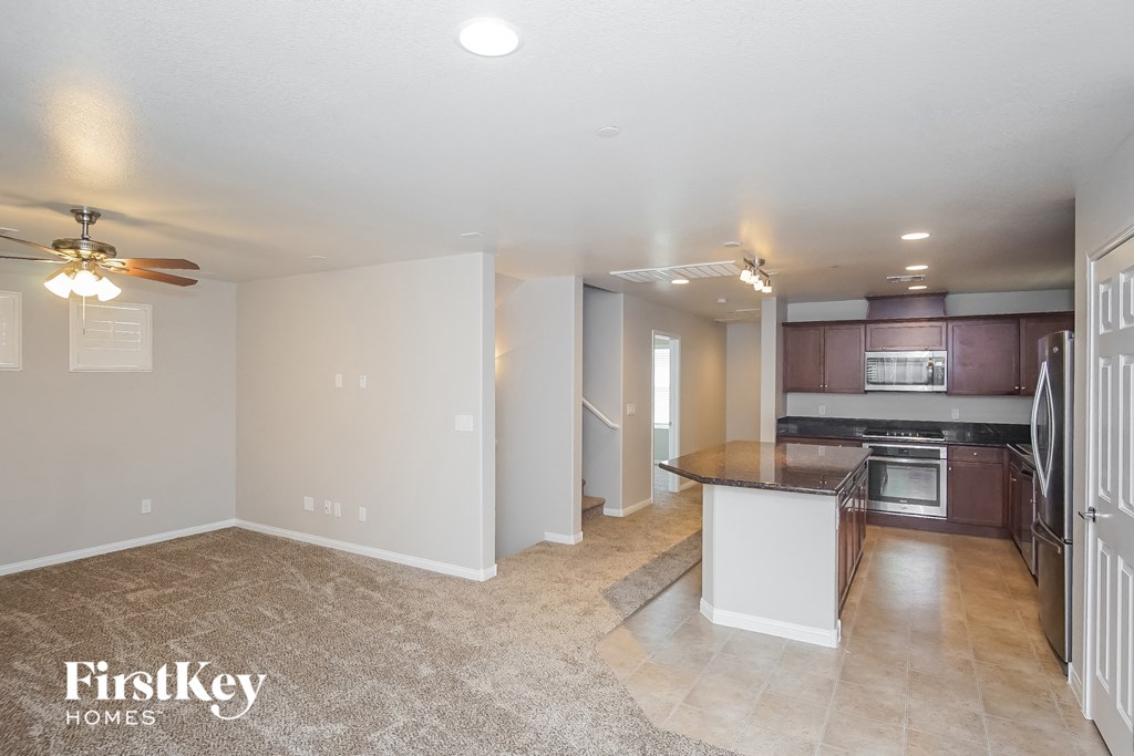 the kitchen is open to the dining room and living room