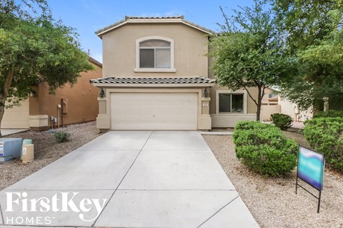 a home with a driveway and a garage door