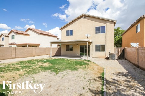 a backyard with a yard and a house