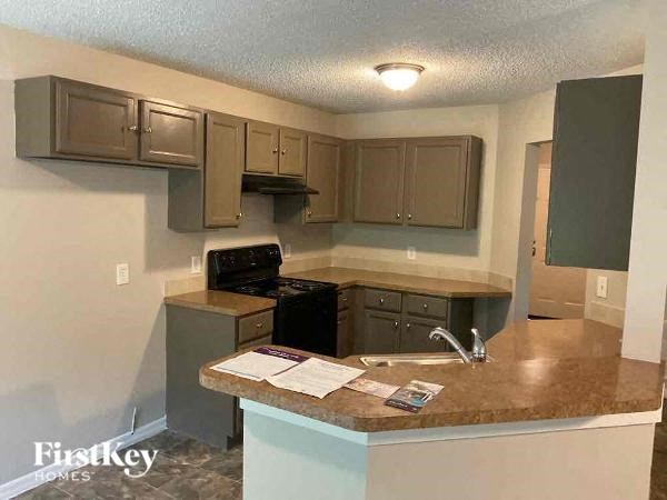 a kitchen with a counter top and a sink