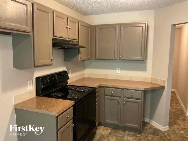 a kitchen with a stove and a sink