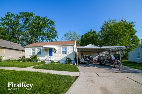 a house with a motorcycle parked in front of it