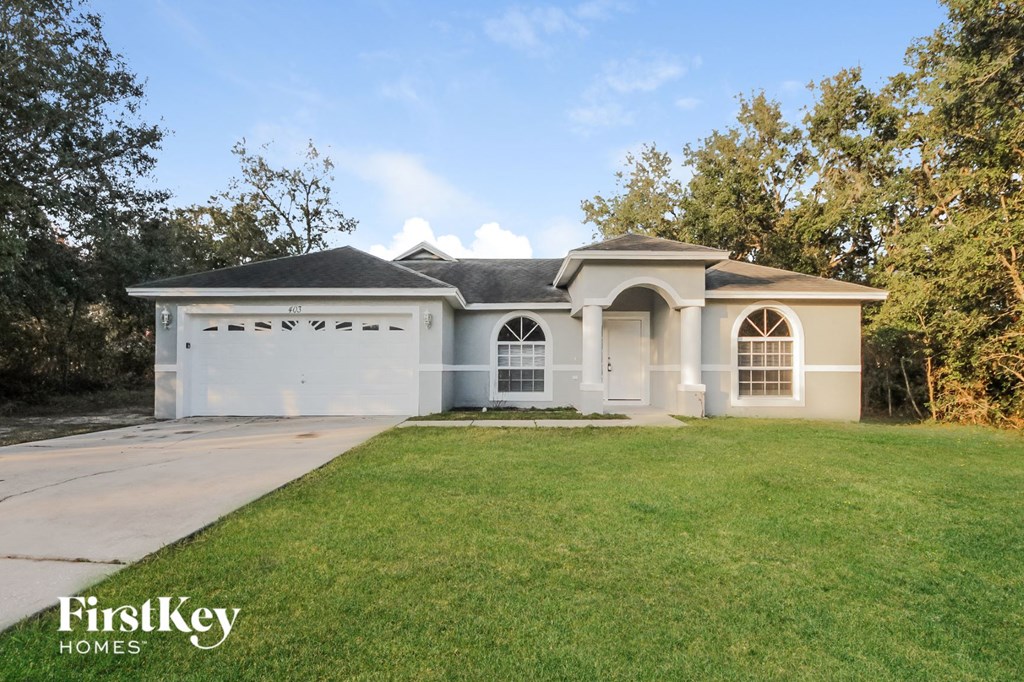 A house with a garage is for sale by FirstKey Homes.