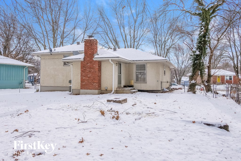 a house with snow on the ground