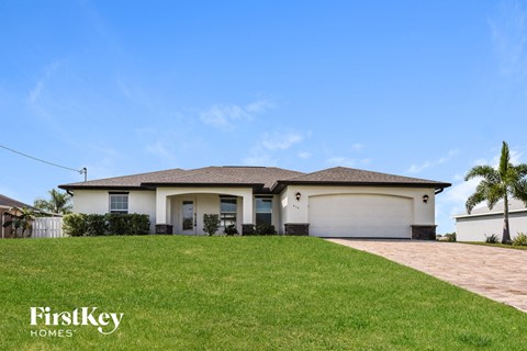 a house with a lawn in front of it