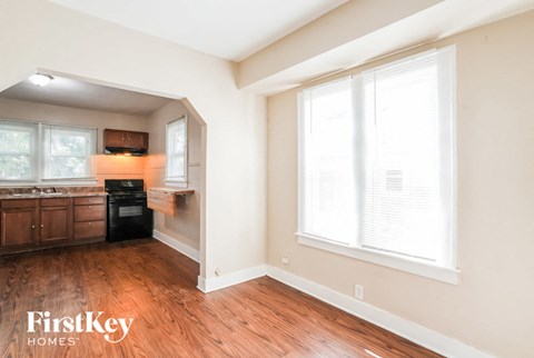 A kitchen with wooden floors and a window.