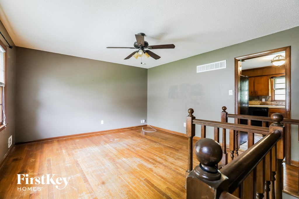 the living room and dining room from the top of the stairs