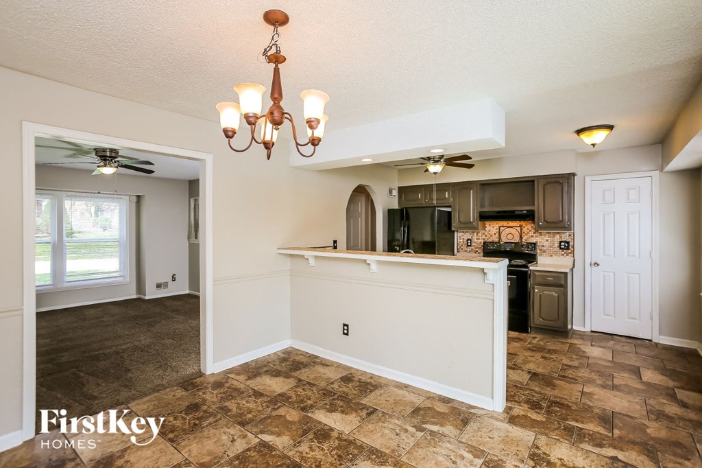the kitchen is open to the living room and dining room
