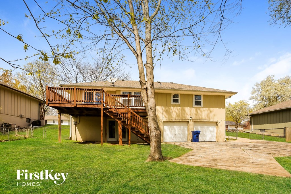 a house with a deck on top of a tree
