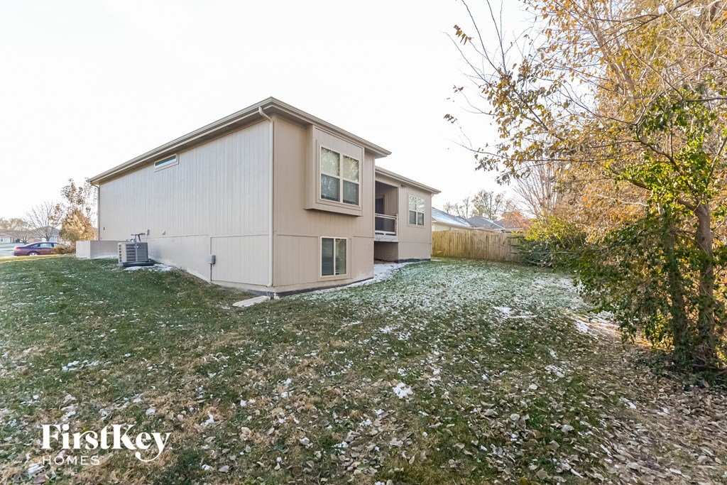 a house with a yard covered in snow