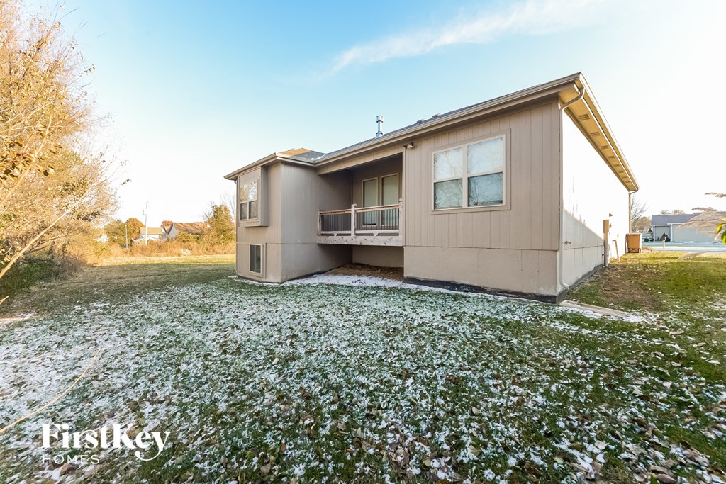 a home with a yard covered in snow