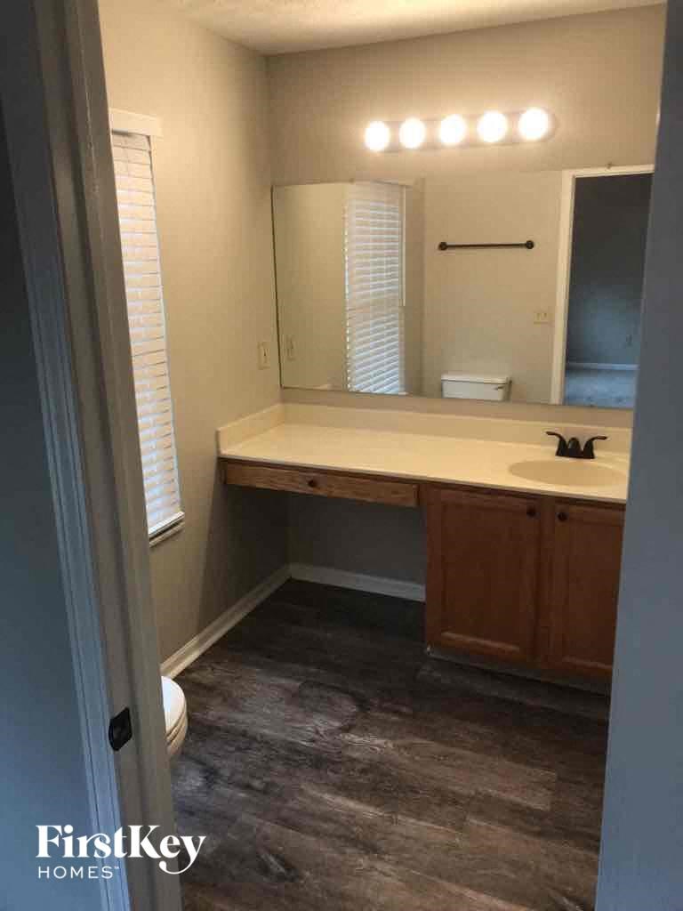 a small bathroom with a sink and a mirror