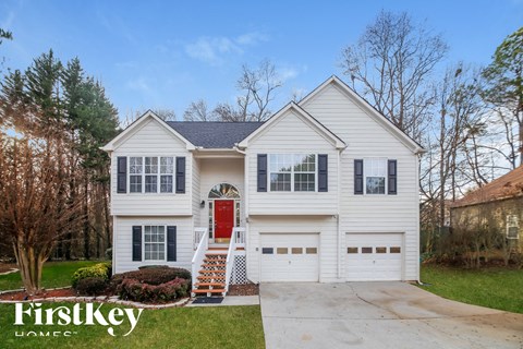 a white house with a red door