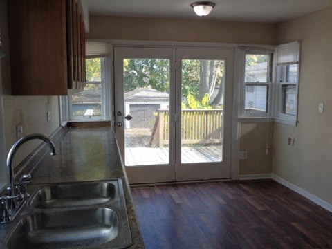 A kitchen with a sink and a window.