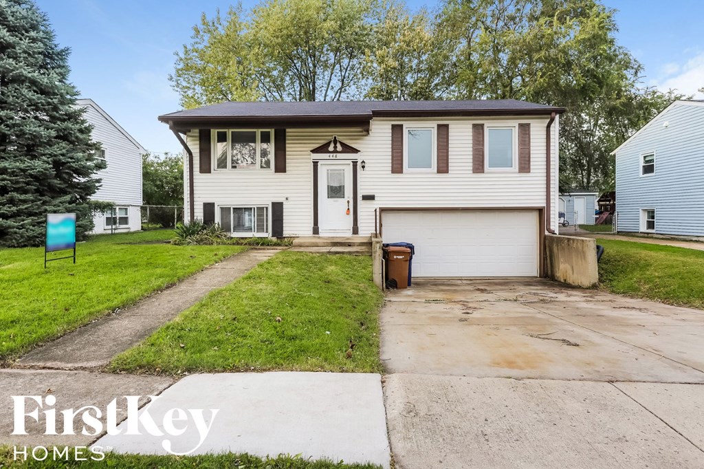 A house with a garage is for sale.