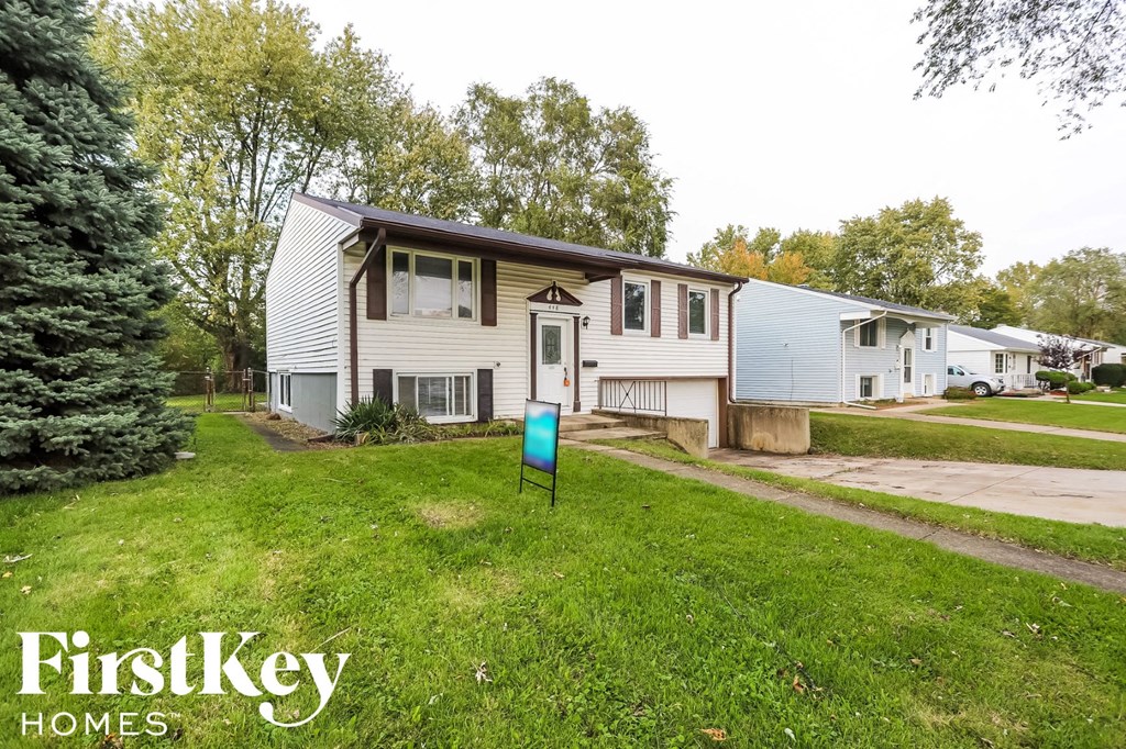 A house with a lawn in front of it is for sale.