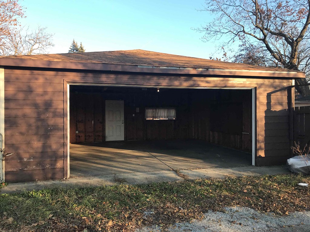 a car garage with the door open