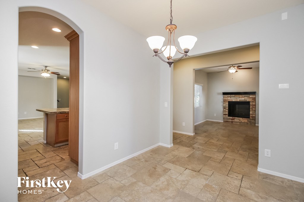 the living room is open to the dining room and kitchen
