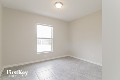the living room of an empty house with a window