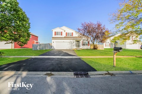A house with a driveway in front of it.
