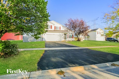 A house with a driveway in front of it.