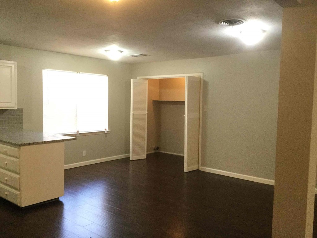 A kitchen area with a counter and a window.