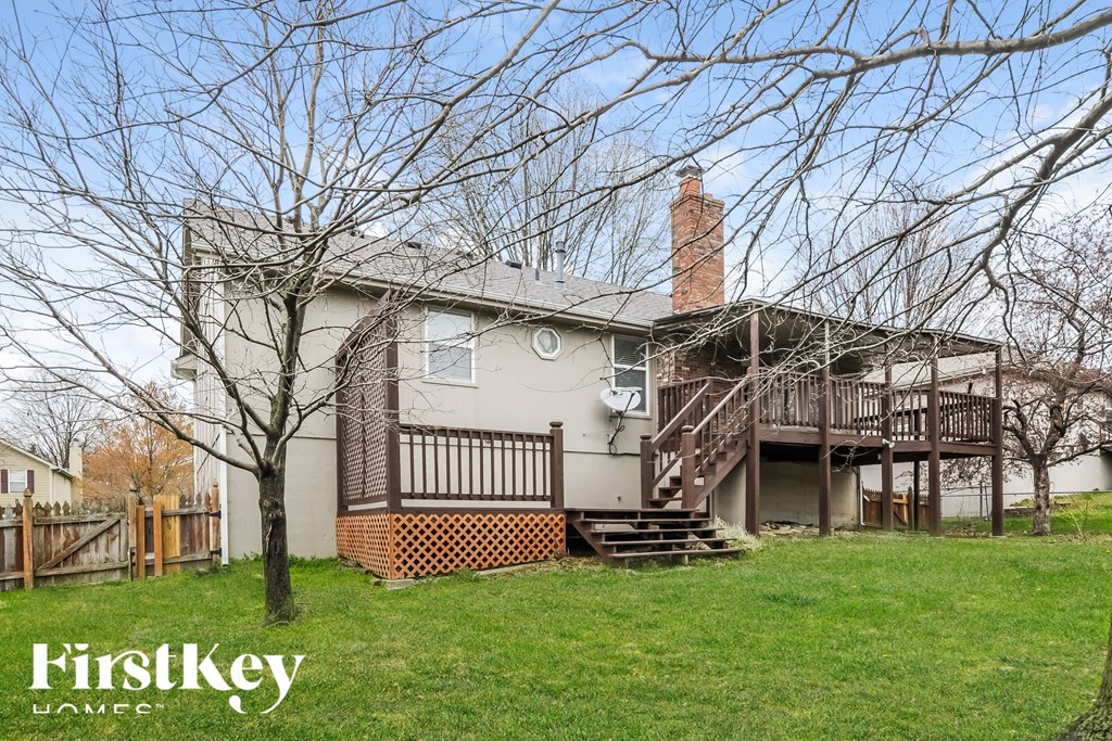 A house with a tree in front of it.