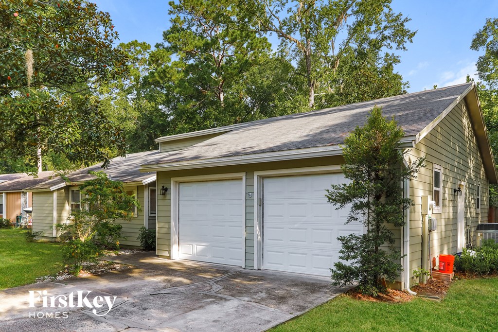 A house with a garage is for sale by FirstKey Homes.