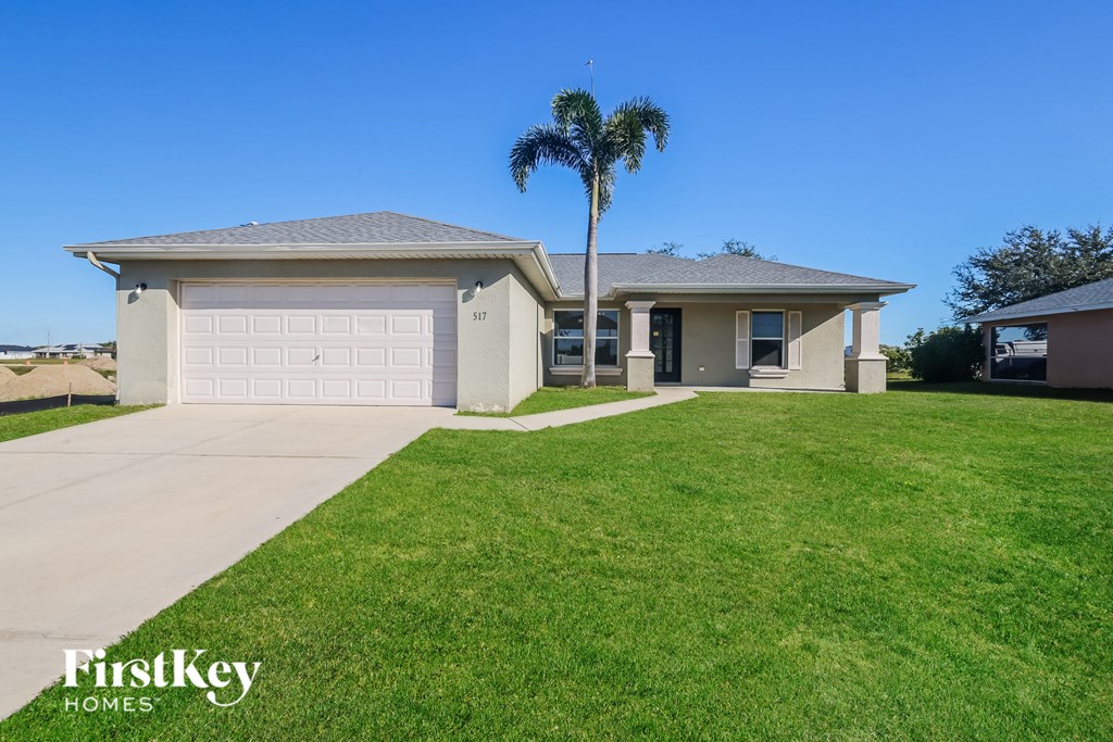 A house with a palm tree in front of it.
