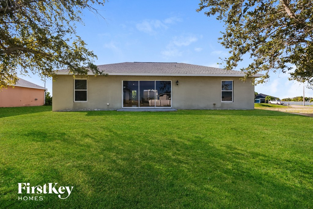 A house with a lawn in front of it.