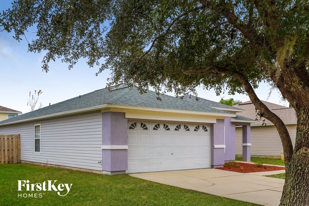 A house with a garage is for sale by FirstKey Homes.