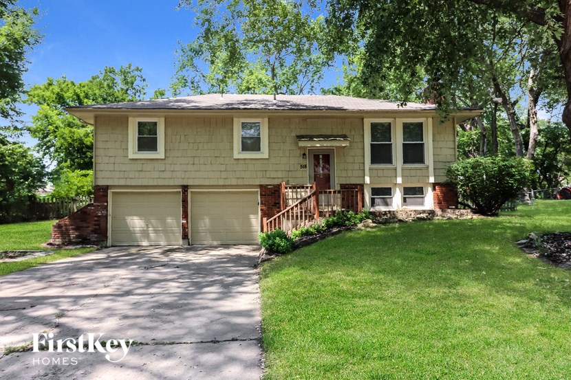 A house with a garage is for sale.