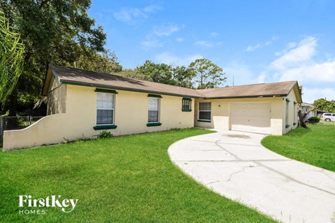 A house with a driveway in front of it.