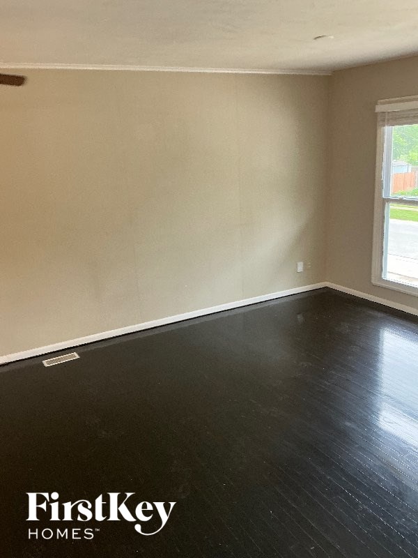 A room with a FirstKey Homes logo on the floor.