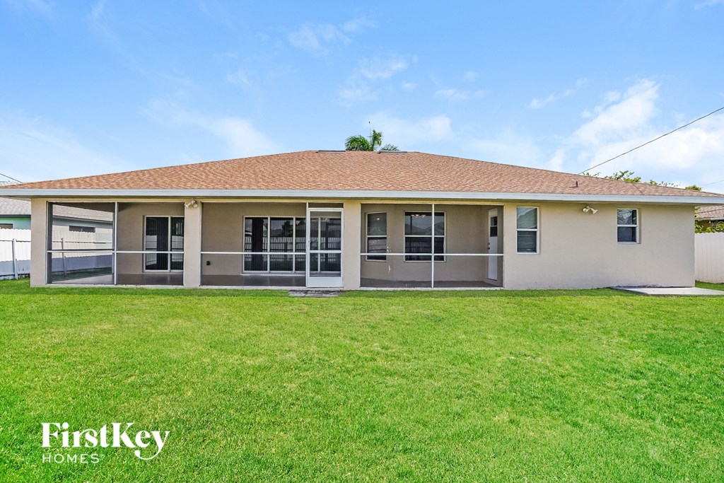 a small house with a lawn in front of it